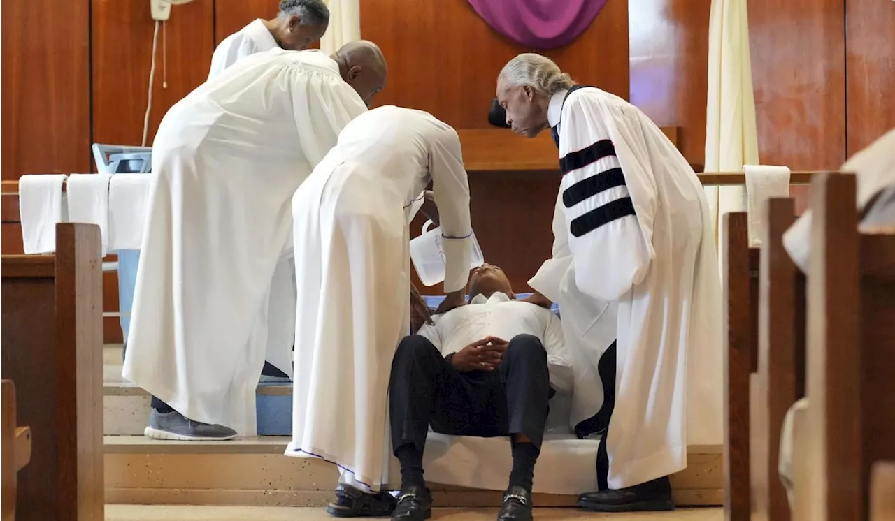 Eric Adams, NYC mayor, gets baptized in jail by Rev. Al Sharpton on Good Friday