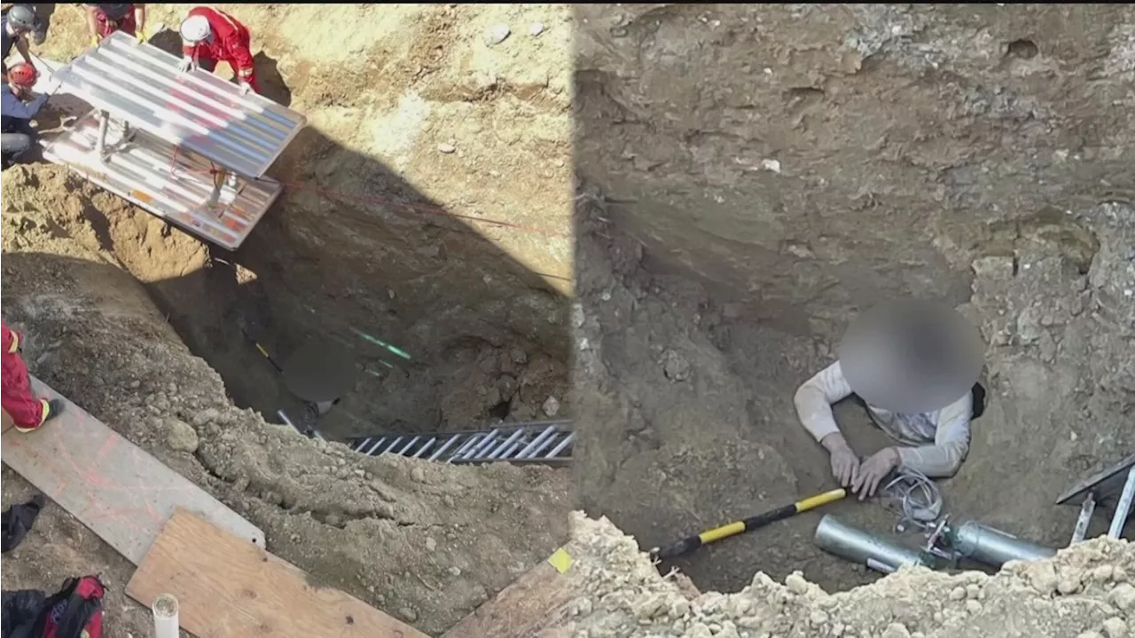 Construction worker rescued by first responders after he was trapped 20 feet underground up to his neck