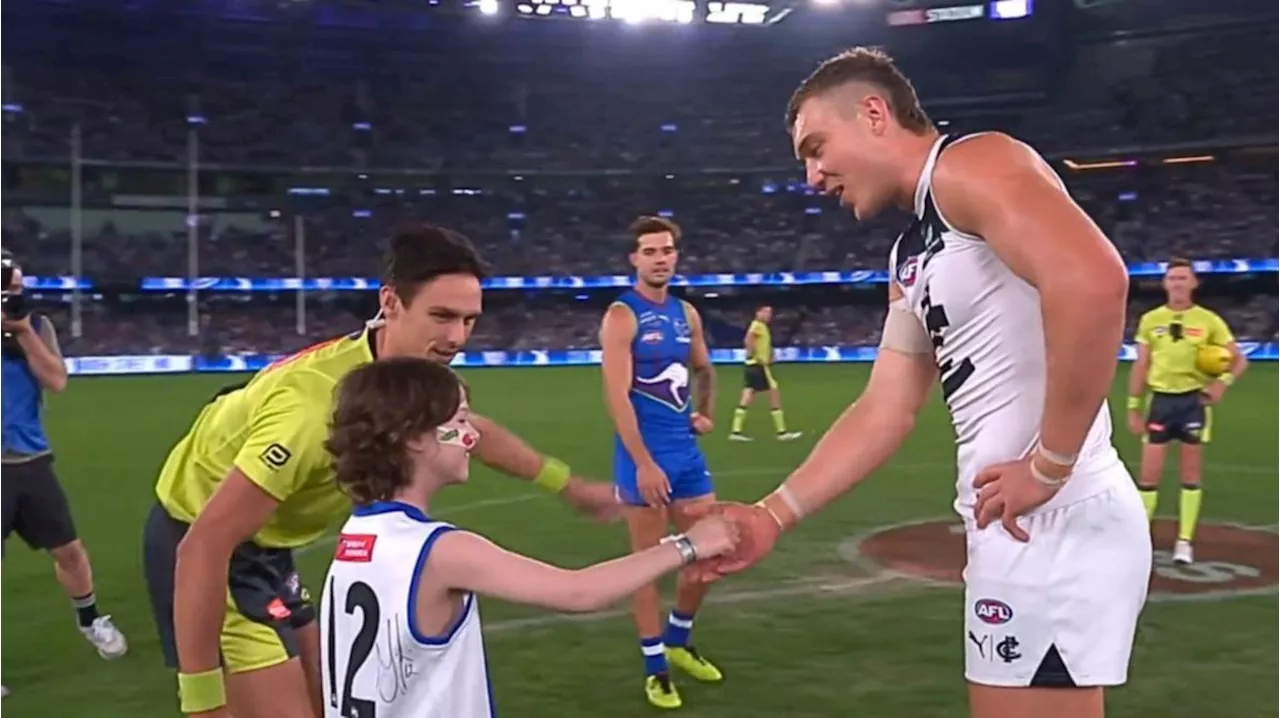 Imogen Mulgrew melts hearts at coin toss for North Melbourne’s clash with Carlton