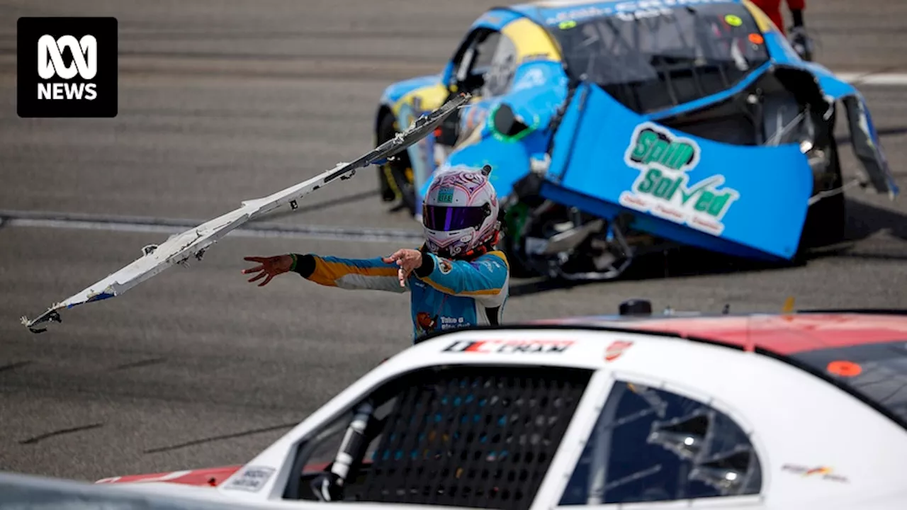 NASCAR driver Joey Gase throws bumper at another car after Richmond crash