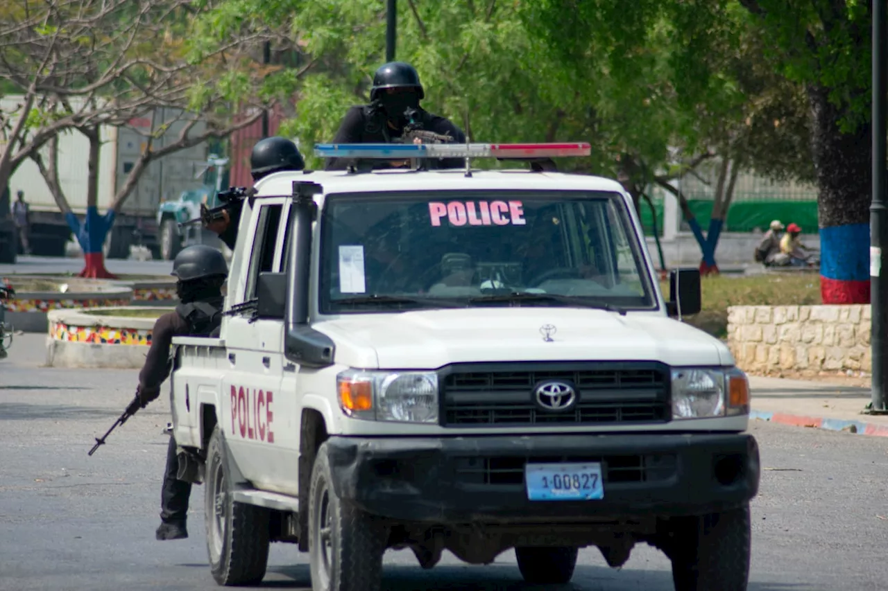 Police in Haiti say 2 men were hacked to death by a mob who thought they were buying ammo for gangs