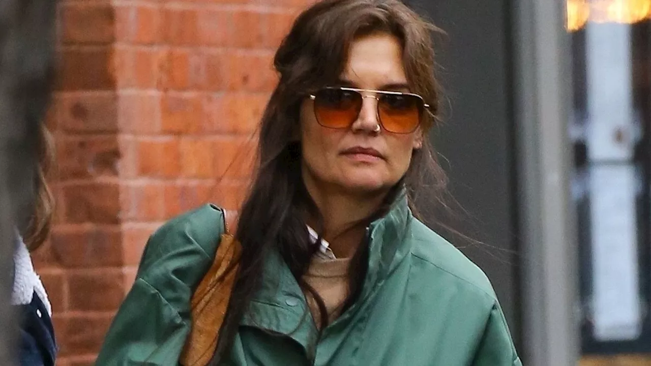 Suri Cruise, 17, pictured with beautiful long hair as she heads off for last vacation with mum Katie Holmes before her 18th birthday