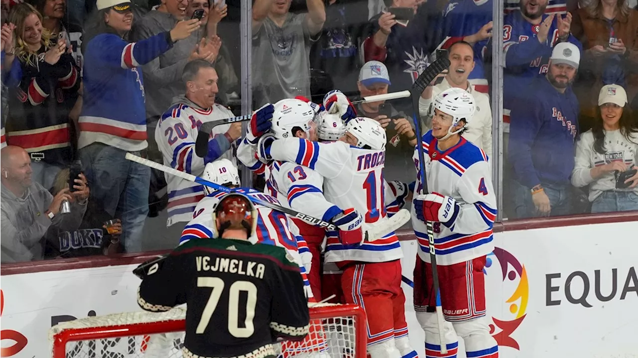 NHL-leading Rangers get 50th win, Quick sets US record in 8-5 victory over Coyotes