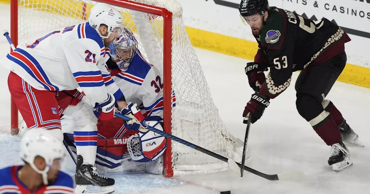 NHL-leading Rangers get 50th win, Quick sets US record in 8-5 victory over Coyotes