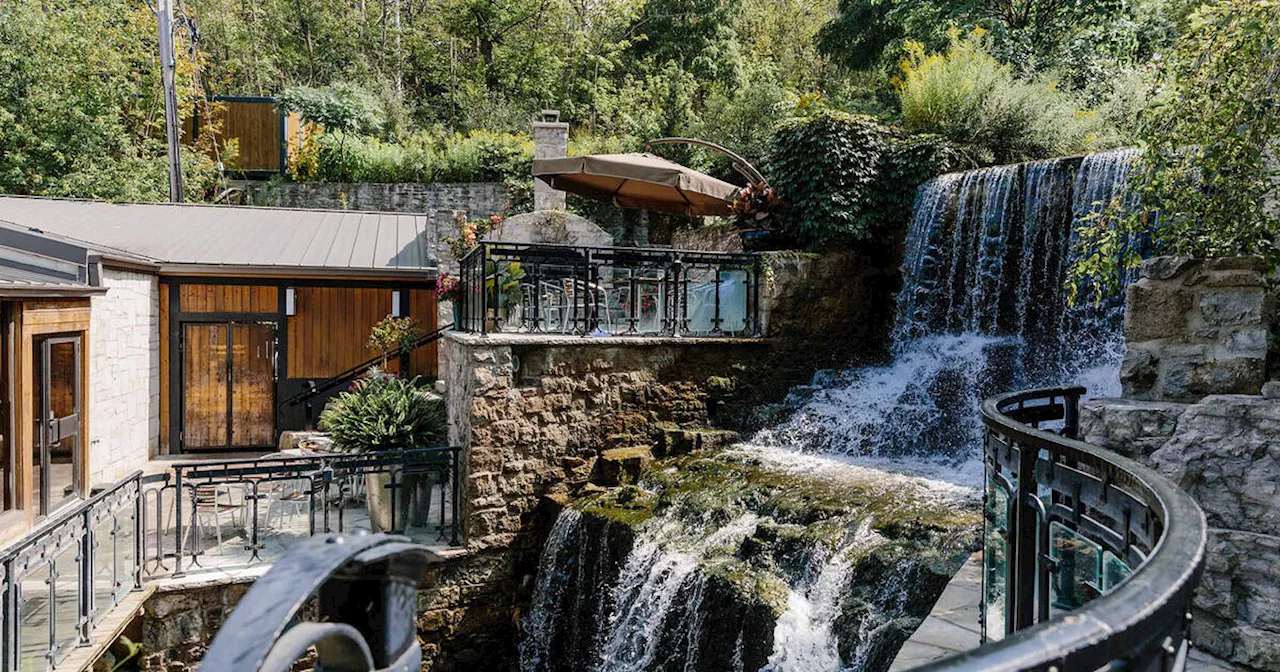 The Ancaster Mill in Ontario is literally built around a breathtaking waterfall