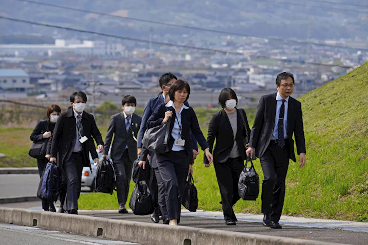 Japanese health officials inspect two factories producing health supplements linked to deaths