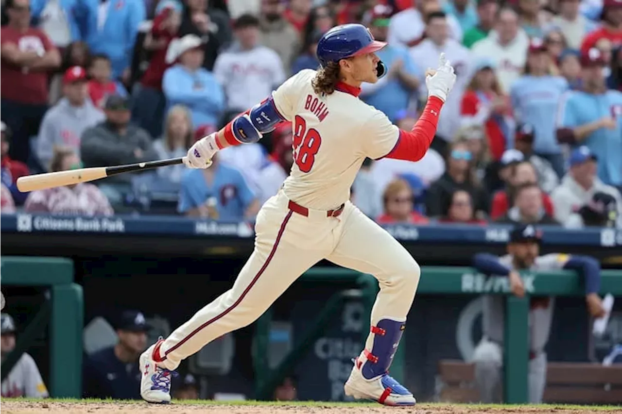 Phillies avert a season-opening sweep by the Braves with a three-run rally in the seventh