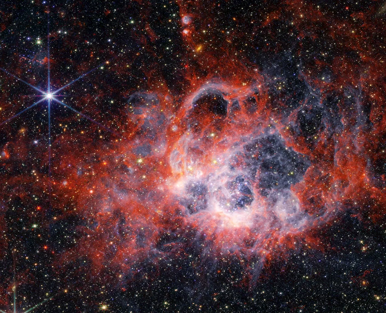 Decoding Star Genesis: Webb’s Infrared Insight Into NGC 604