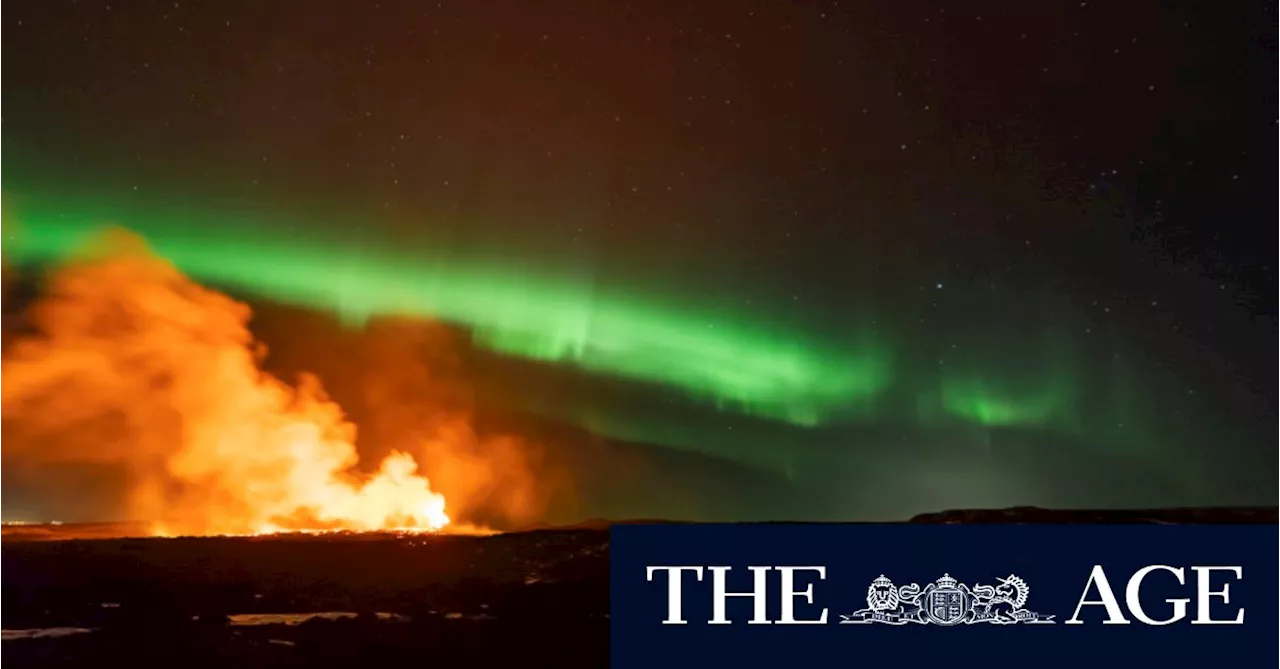 Timelapse shows Iceland volcano erupting amid northern lights