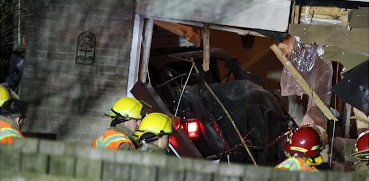 Suspect crashes into Ajax home following break-in at bank, second suspect also arrested