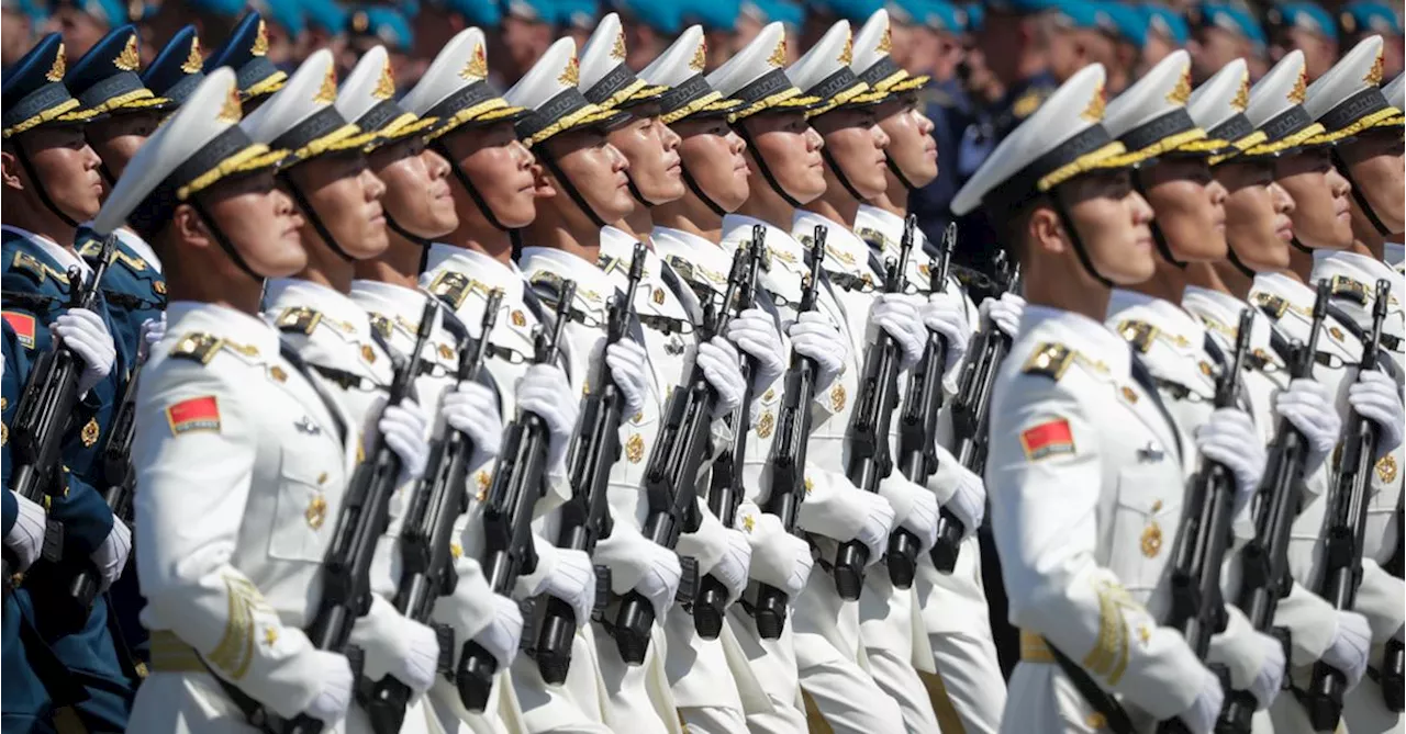 China increases spending on defence, toughens its official stance on Taiwan