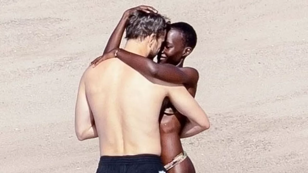 Joshua Jackson passionately embraces bikini-clad girlfriend Lupita Nyong'o on a beach in Puerto...