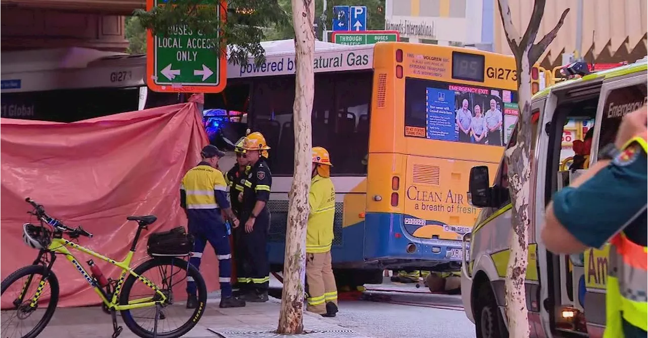 Young woman dies after being pinned by bus against a building in Brisbane CBD crash