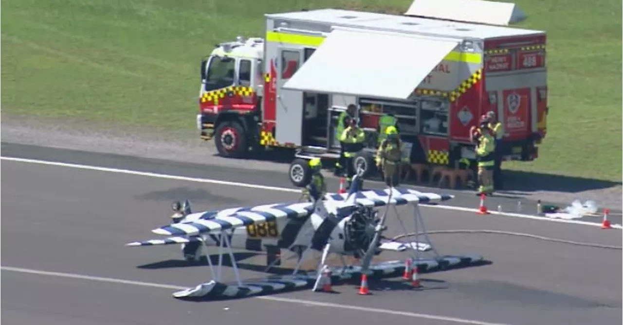 Vintage plane lands upside down on regional NSW airport runway