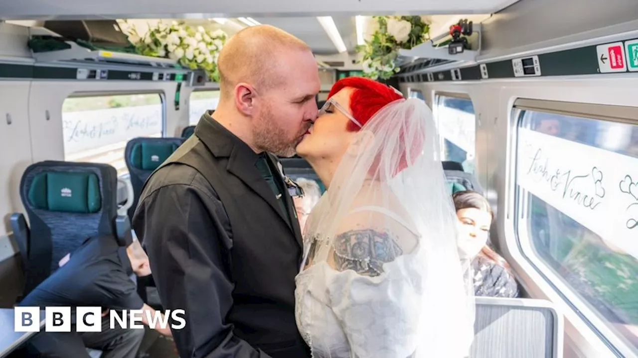 Coupling: Rail-crazy pair get married on moving train