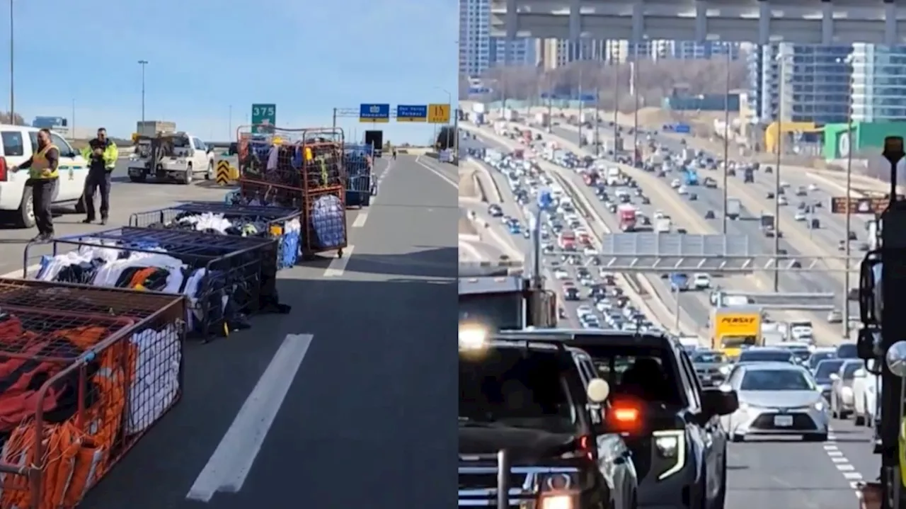 Linen racks tumble off truck causing heavy traffic on Highway 401 in Toronto