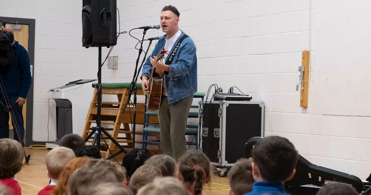 Scots singer Callum Beattie surprises school assembly with performance