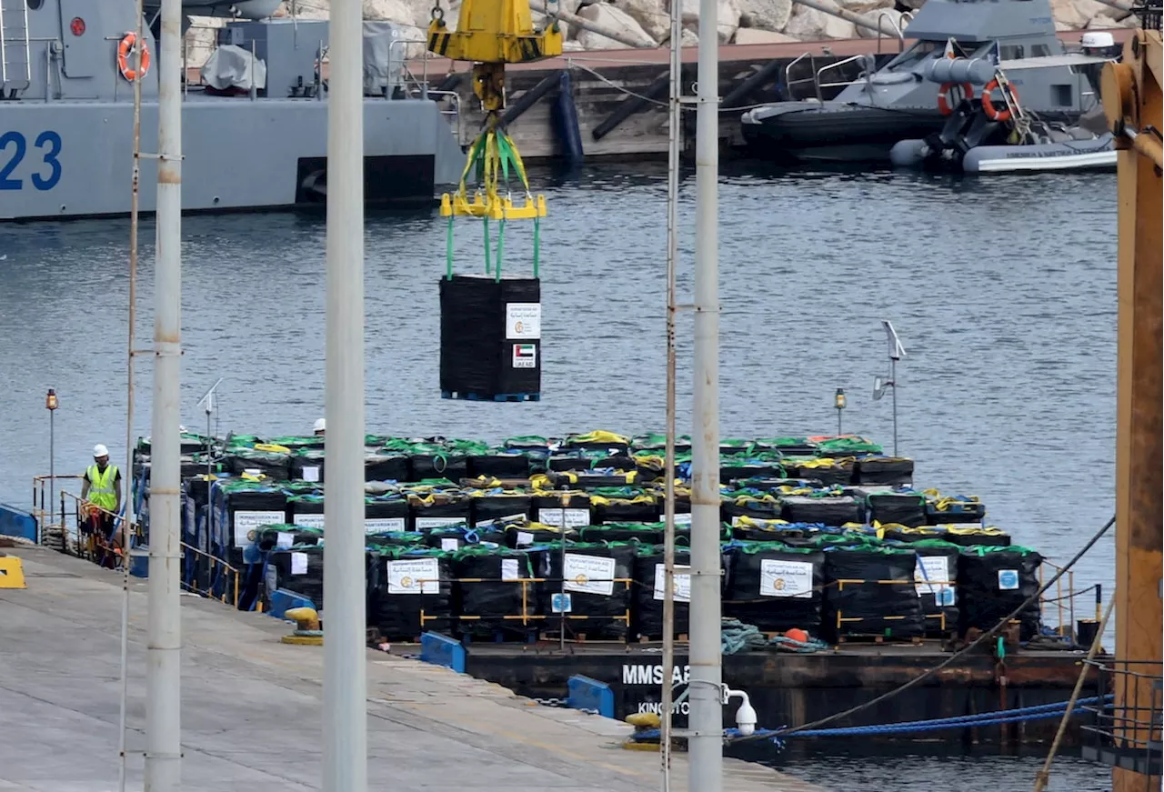 Charity workers load food aid on to barge in Cyprus headed for Gaza