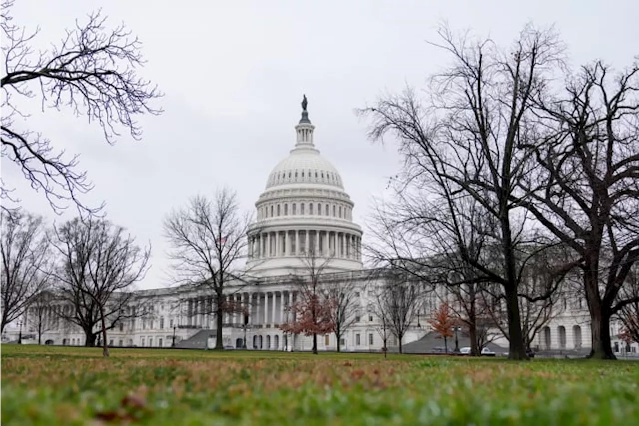 Biden signs a package of spending bills passed by Congress just hours before a shutdown deadline