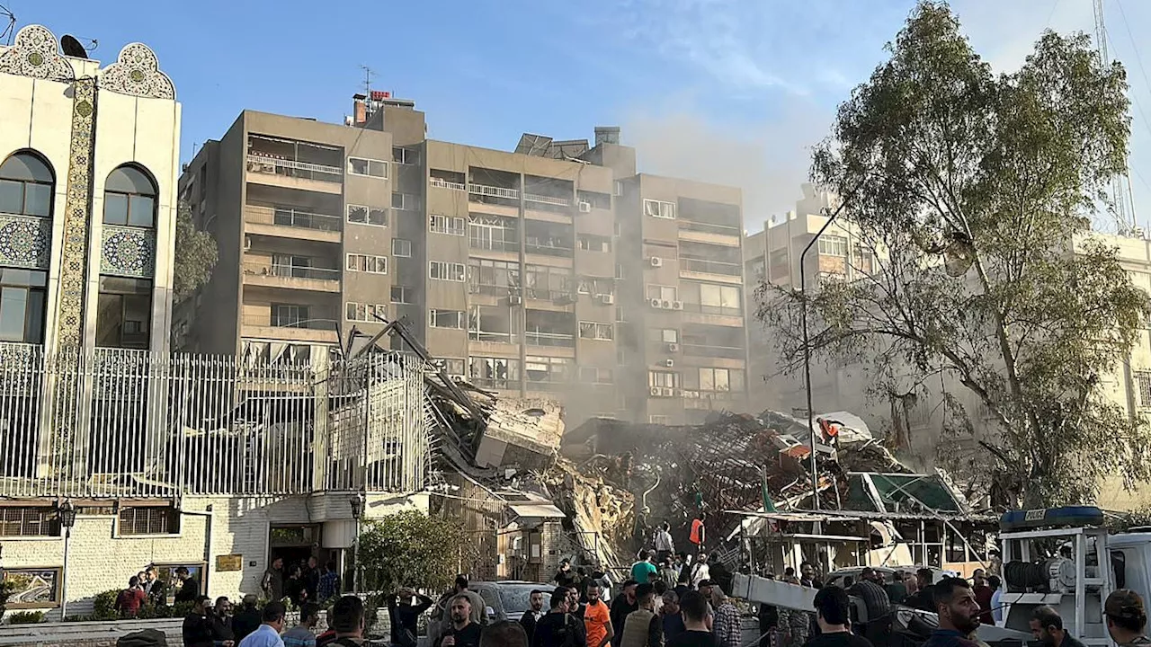 Iranian military leader is 'killed' alongside five others as building next to embassy in Damascus is...