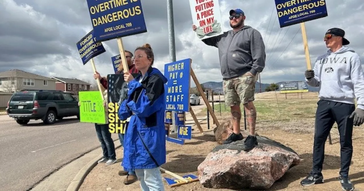 Employees picket for better pay, hours at Littleton federal prison