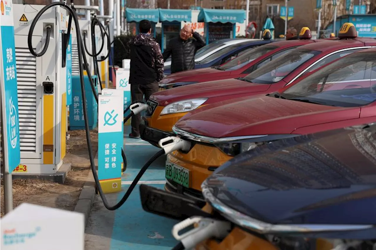 Analysis-China's oil majors face uphill climb to adapt to EV future