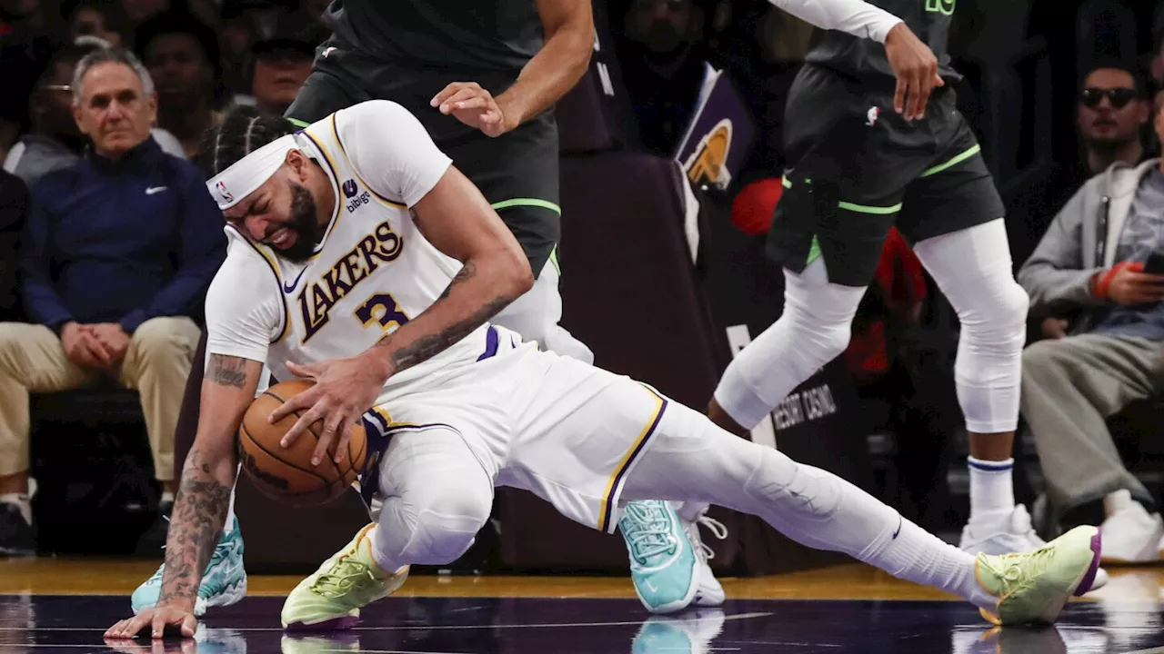 Anthony Davis Slips and Commits Foul in Lakers Game