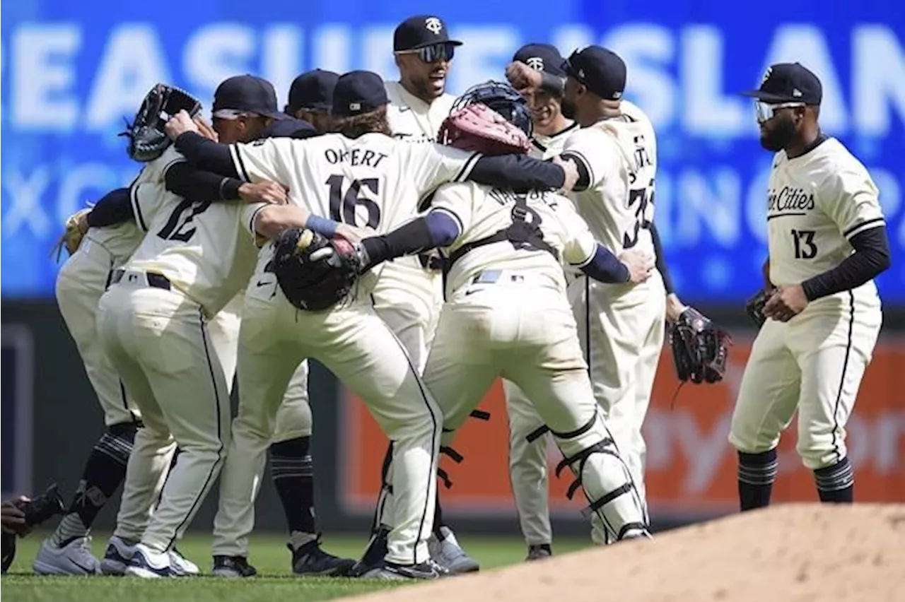 Julien's Two Homers Lead Twins to Victory over Dodgers