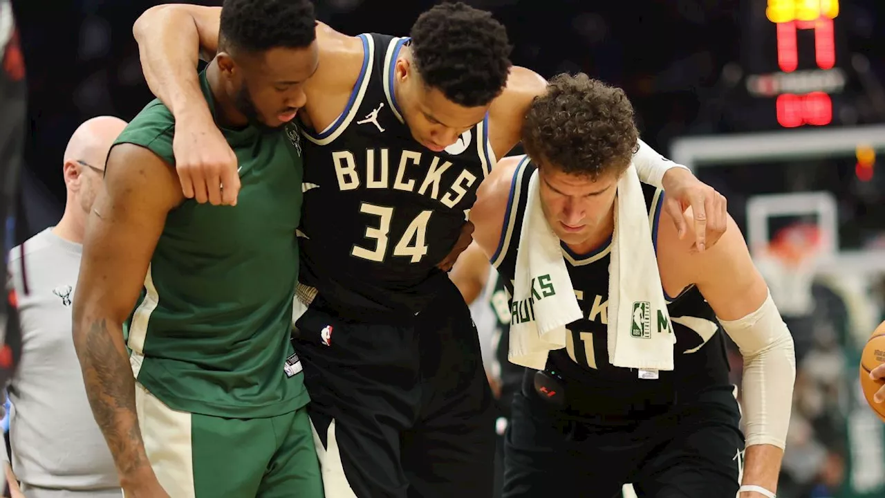 Bucks' Giannis Antetokounmpo helped off court with calf injury