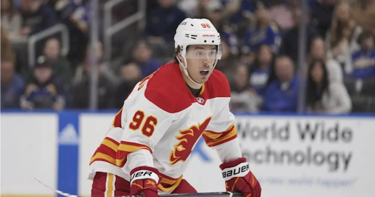 Kuzmenko scores in OT to lift Flames to 3-2 win over Sharks