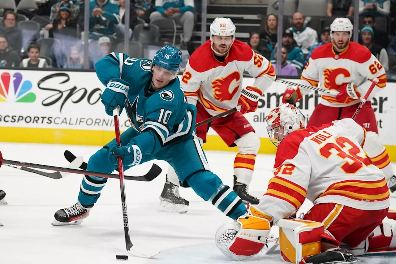 Kuzmenko scores power-play goal in OT, Flames beat Sharks 3-2 to stop skid