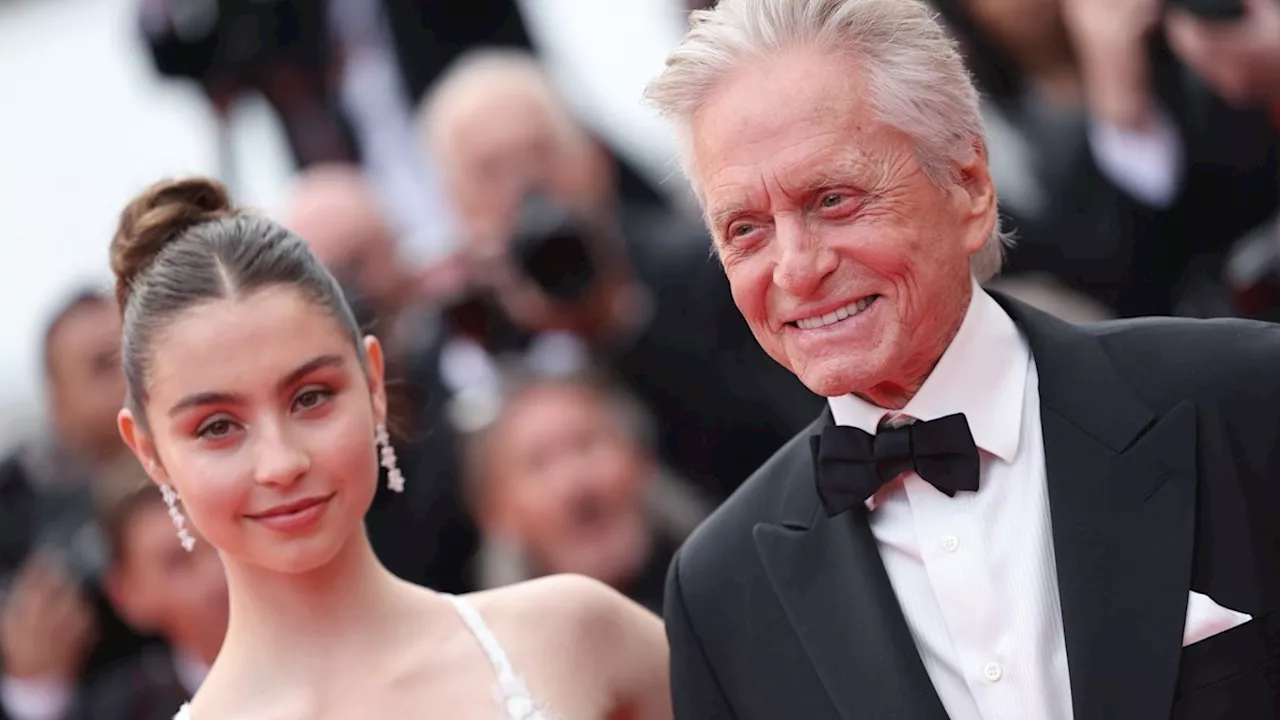 Michael Douglas' daughter Carys displays incredible curves in sultry wedding guest dress