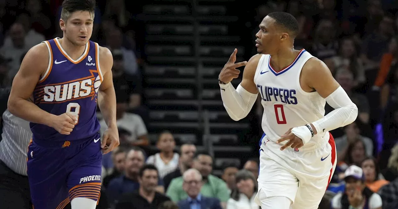 Clippers hold off Suns to clinch a playoff spot