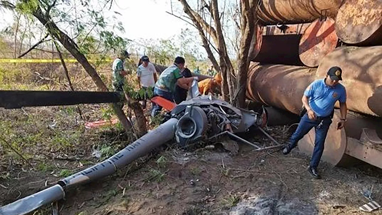 2 Philippine navy pilots killed after a training helicopter crashes near a public market and homes