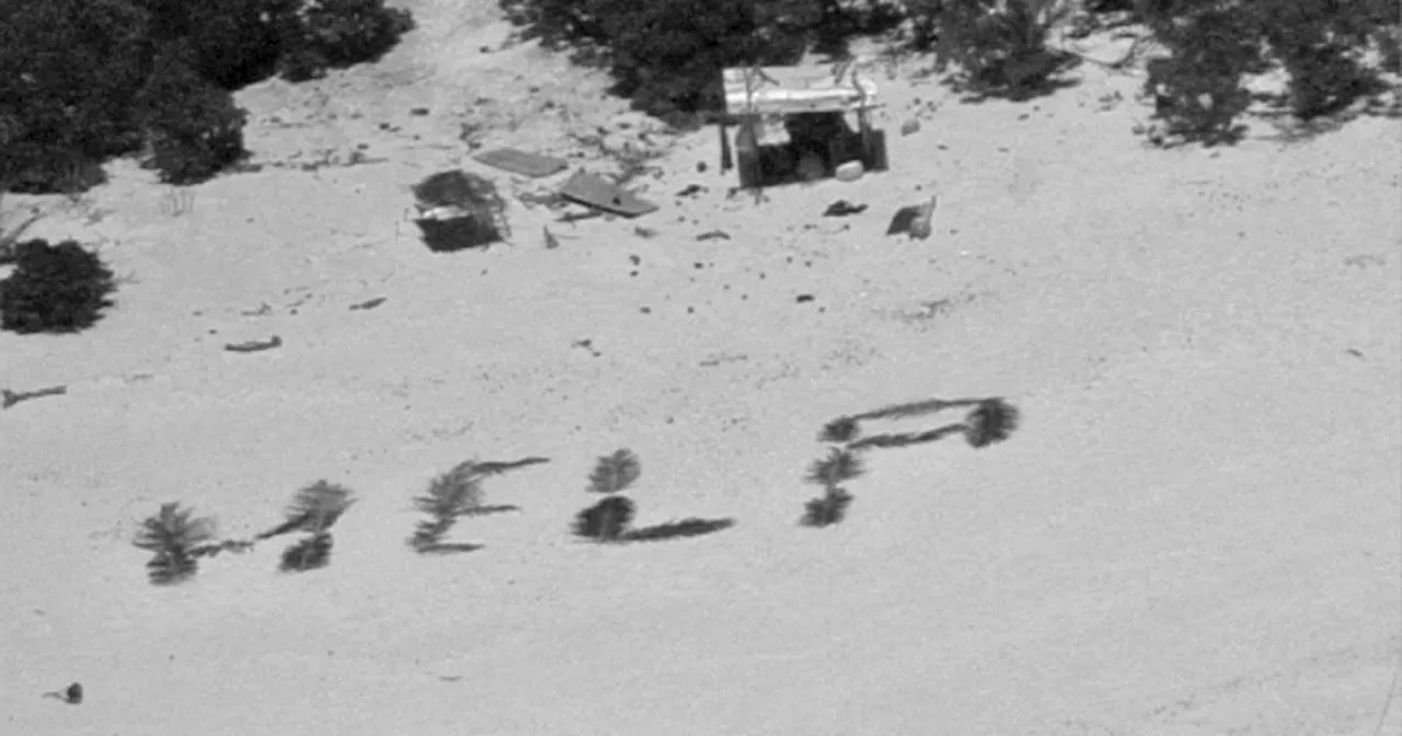 'HELP' sign on tiny Pacific island leads to Coast Guard and Navy rescue of 3 mariners stranded for over a week