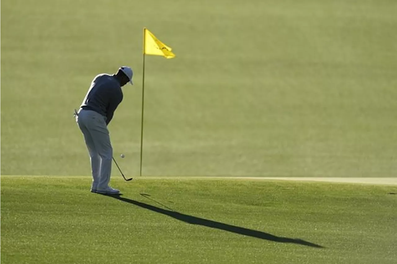 Tiger Woods completes opening round at Masters with a 73, eight shots off the lead