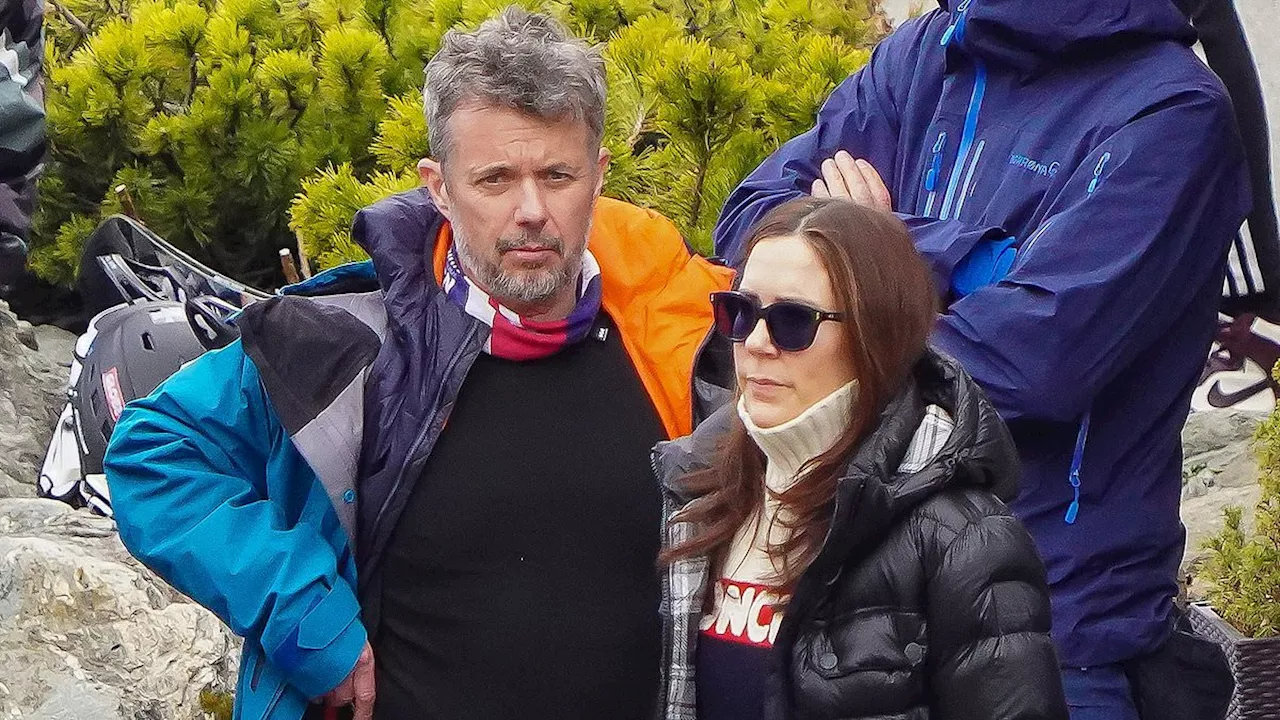 Queen Mary of Denmark cuts a frosty figure as she looks away from King Frederik on skiing trip to...