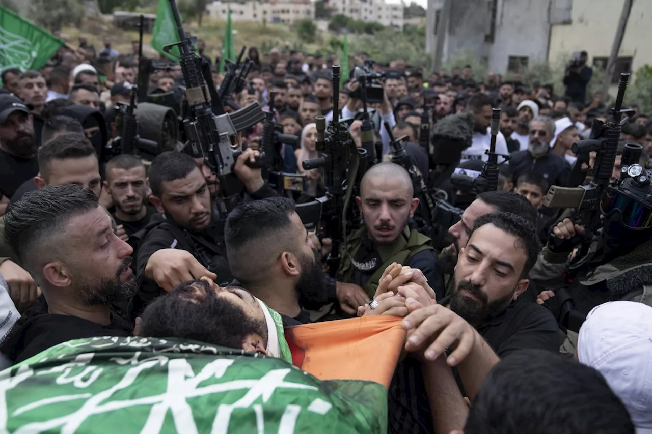 Israeli settlers rampage through a West Bank village, killing 1 Palestinian and wounding 25