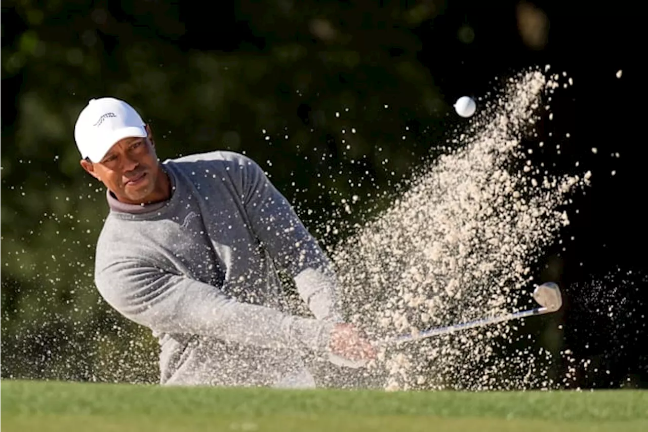 Tiger Woods completes opening round at Masters with a 73, eight shots off the lead