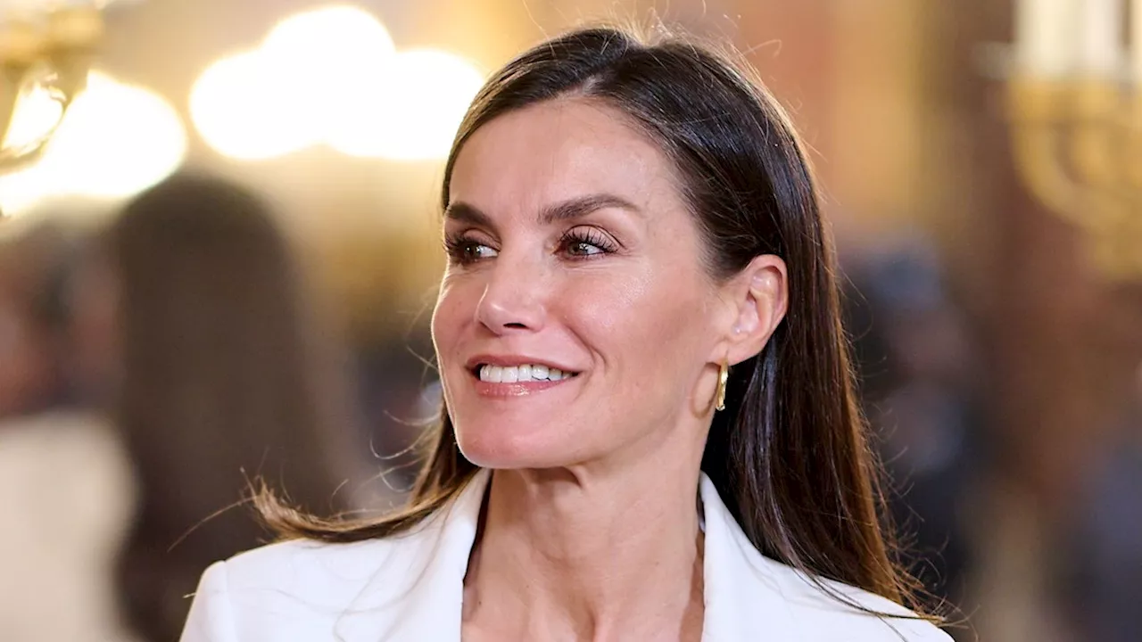 Queen Letizia is divine in unseen figure-skimming linen suit