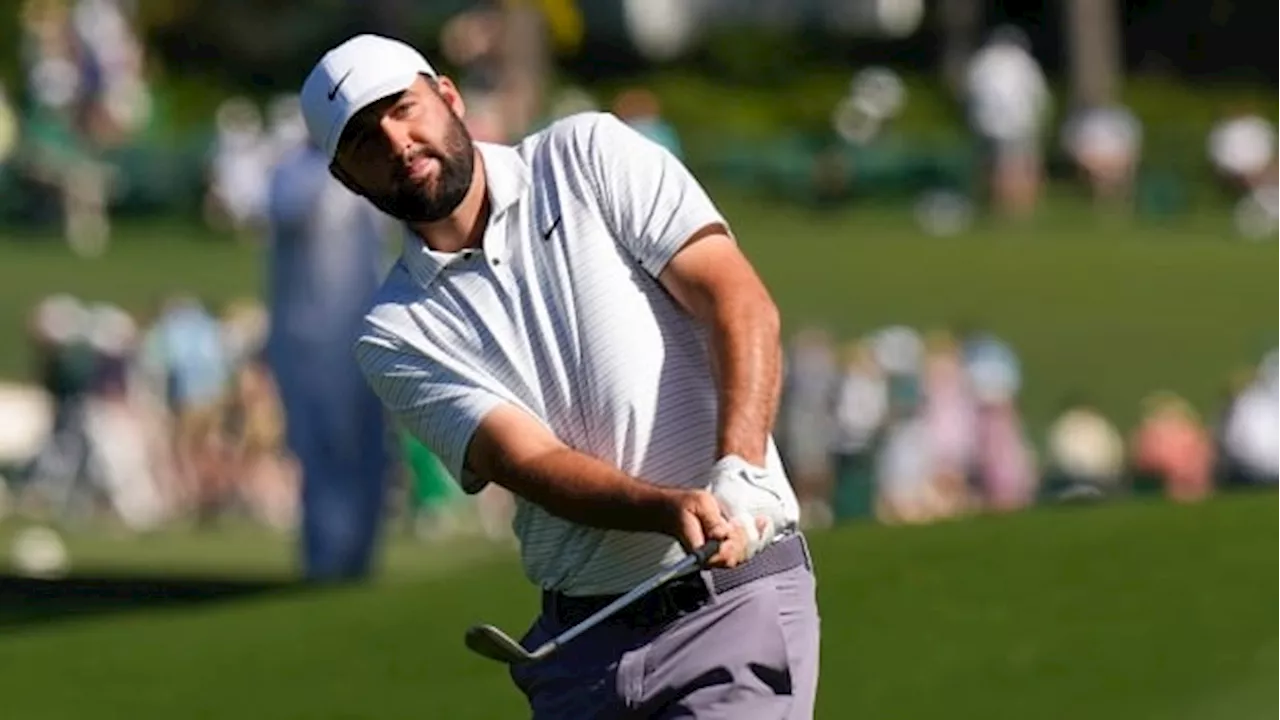 Scottie Scheffler leads Masters by 1 shot on wild day of movement