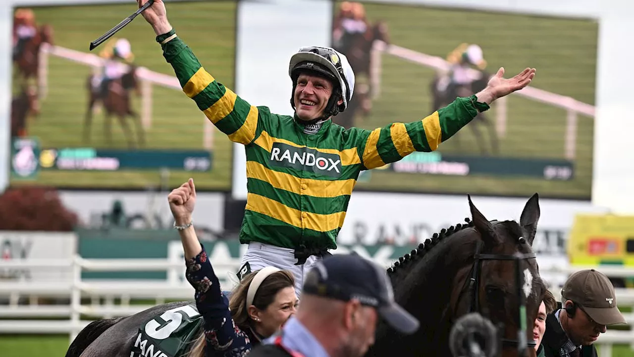 Jockey Paul Townend is rewarded with a kiss from his girlfriend after winning the £1million Grand...