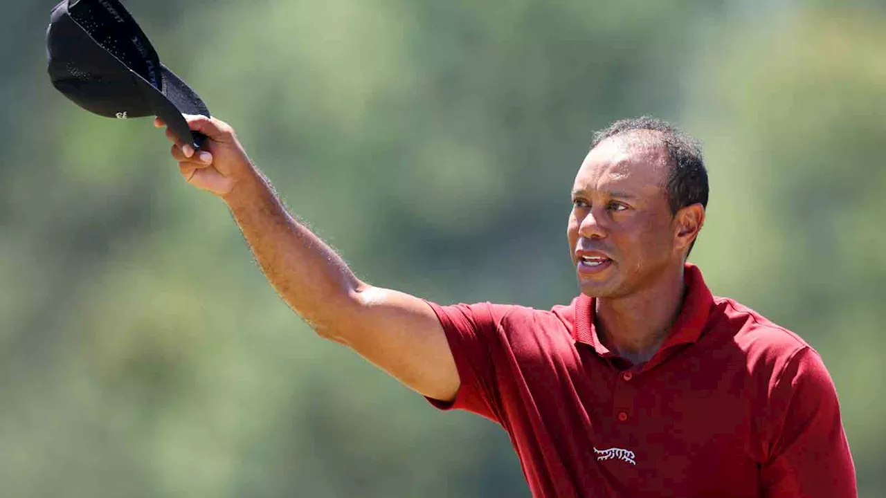 Tree Blocks Embrace Between Tiger Woods and Verne Lundquist at the Masters