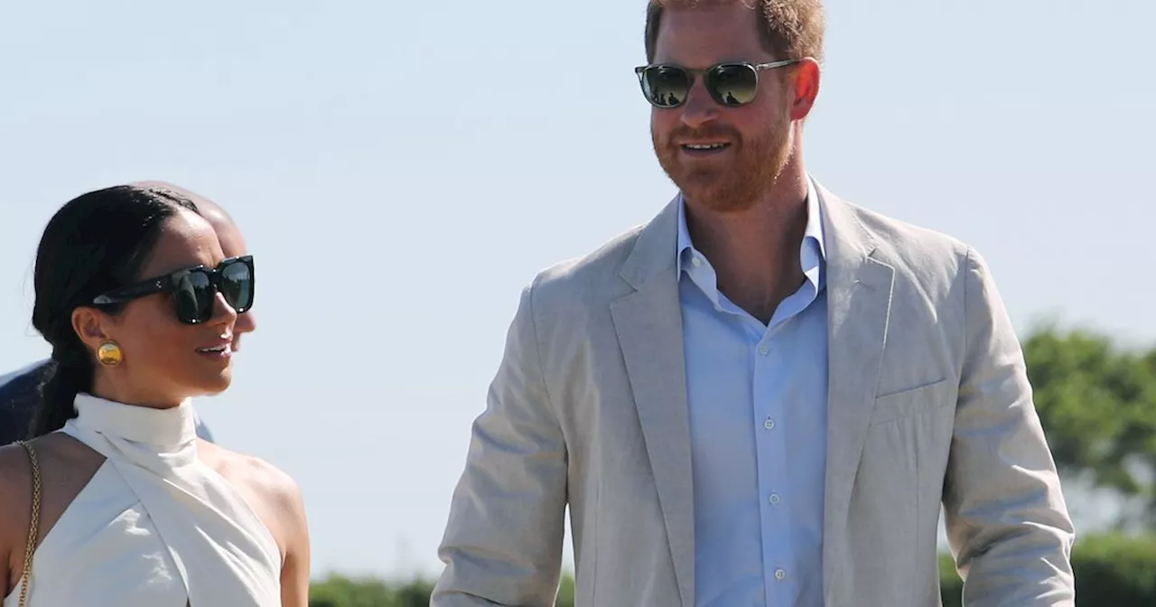 Meghan Markle's awkward moment as she 'asks woman to move from Prince Harry'