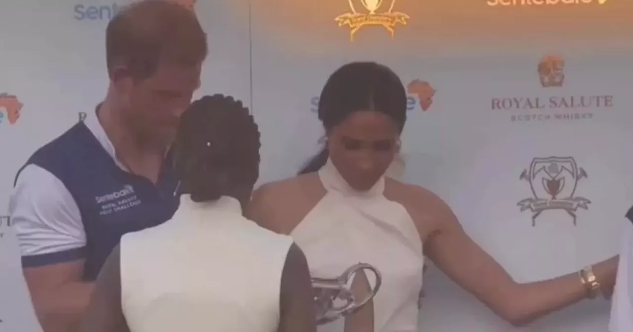 Meghan Markle suffers awkward moment as she asks woman to move away from Harry