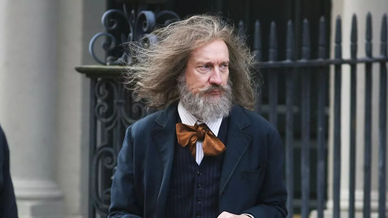 Acting legend looks unrecognisable as he sports long hair and bushy beard while filming in Dublin -...