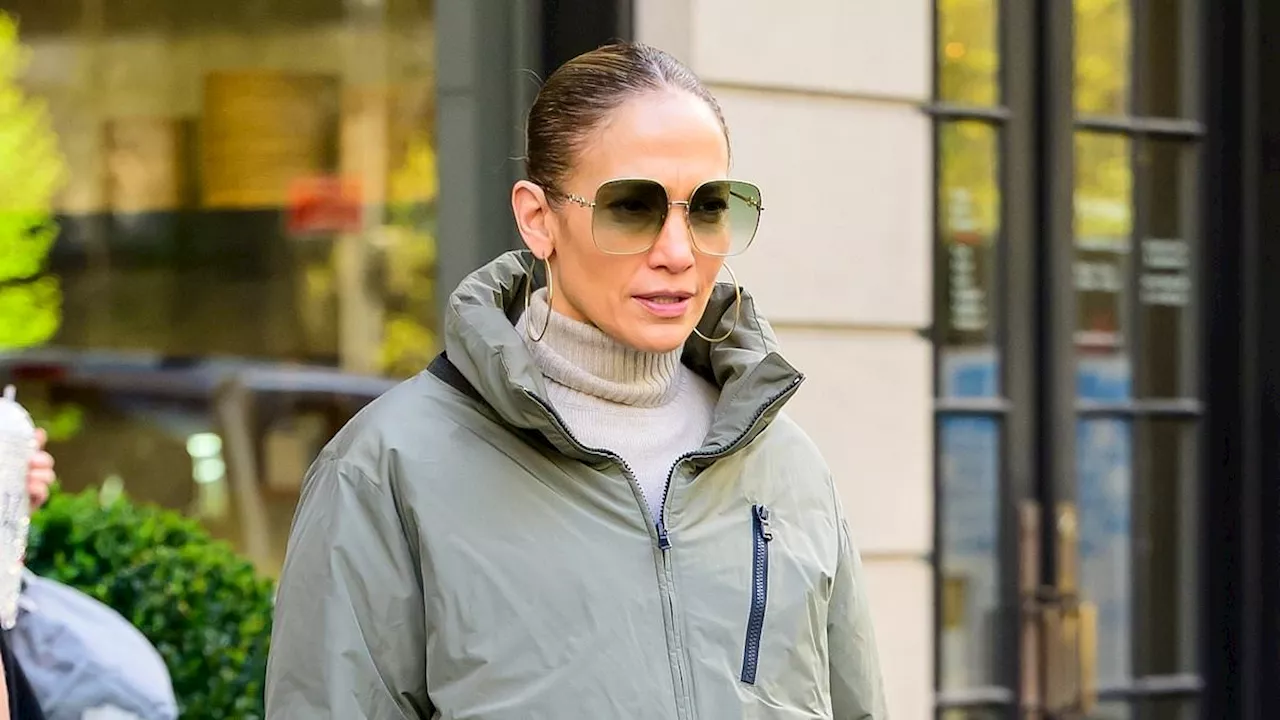 Jennifer Lopez dons green leggings and pale green jacket in New York