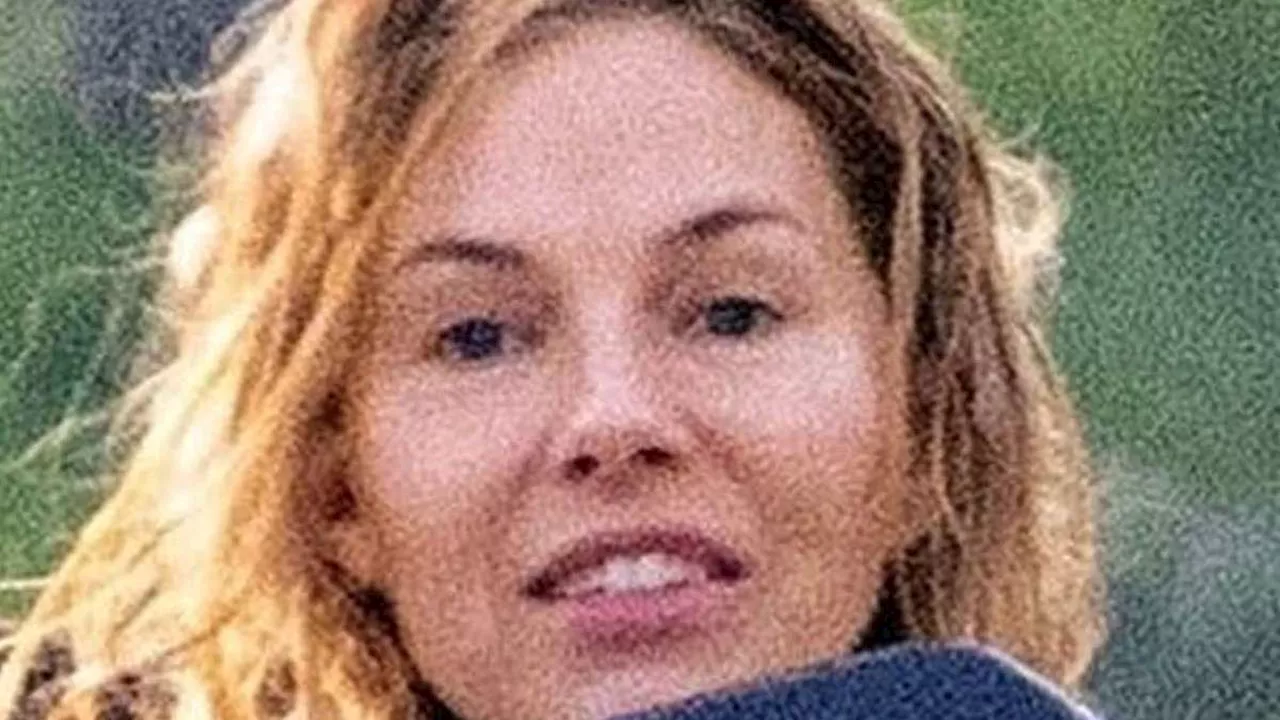 Sienna Miller looks incredible in a tiny black bikini as she surfs the waves in Costa Rica