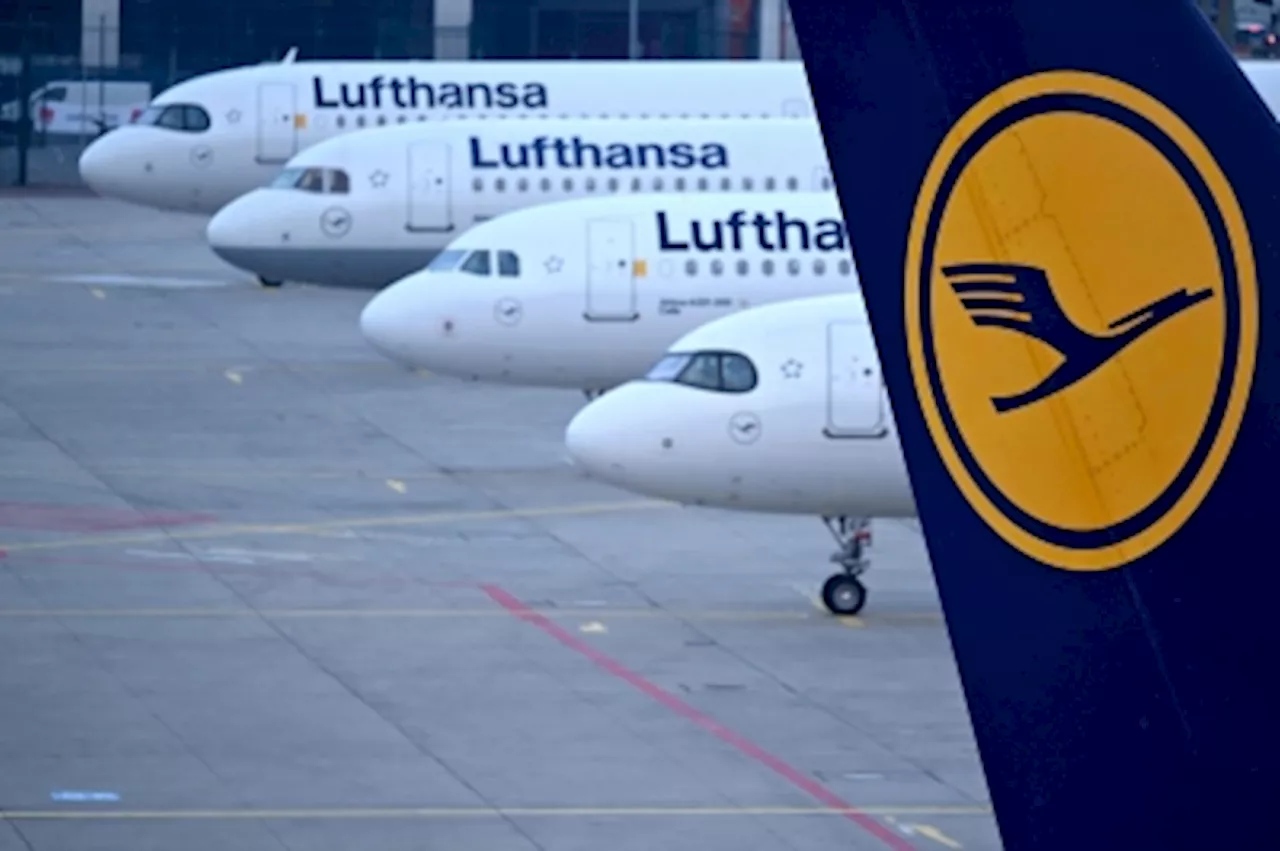 Lufthansa reports loss, cuts outlook after strikes