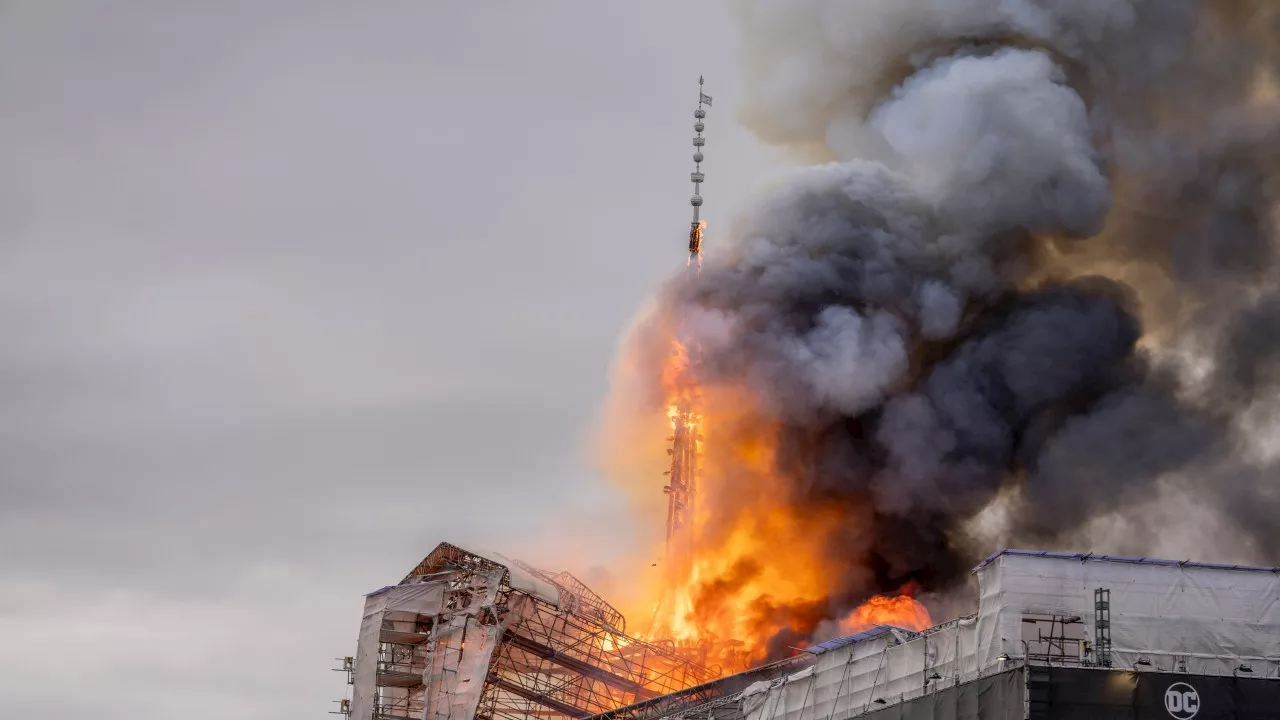 Photos capture moment historic Copenhagen building engulfed in flames